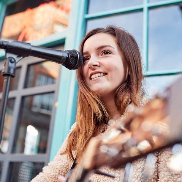 female-musician-busking-playing-acoustic-guitar-QGPZ2UP.jpg female-musician-busking-playing-acoustic-guitar-QGPZ2UP.jpg